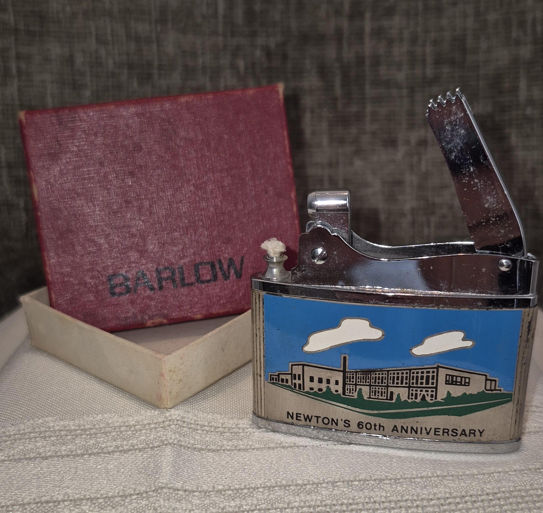 Barlow pocket lighter with enamal graphic for NEWTOWN'S 60th ANNIVERSARY