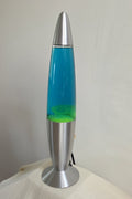 Vintage Lava Lamp Rocket in Yellow with Blue Liquid. Features a unique rocket design.