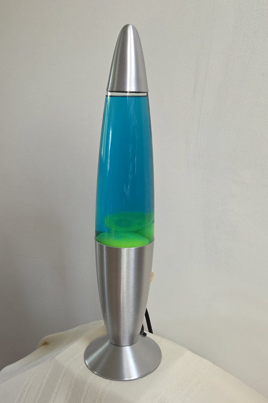 Vintage Lava Lamp Rocket in Yellow with Blue Liquid. Features a unique rocket design.
